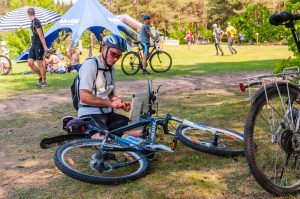 Cyclist getting ready for competition in the forest